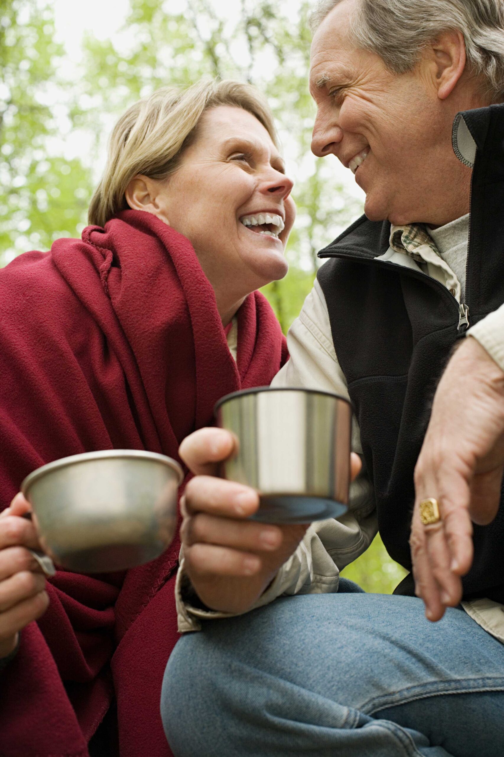 Middle aged couple enjoying a cup of coffee and conversation with the hearing aids matched to their lifestyle supplied by All Ears Audiology Adelaide